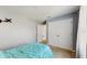 Bedroom with natural light, blue comforter and spacious closet at 1423 Marsh Meadow Ln, Davenport, FL 33896