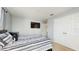 Comfortable bedroom with a modern bed, tv and ample closet space at 1423 Marsh Meadow Ln, Davenport, FL 33896