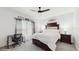 Cozy bedroom featuring a ceiling fan, desk, and plush carpeting at 1423 Marsh Meadow Ln, Davenport, FL 33896