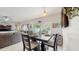 Bright dining area complemented by an open view into the adjacent living room and patio at 1423 Marsh Meadow Ln, Davenport, FL 33896