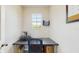 Compact office space with a single window and desk at 1423 Marsh Meadow Ln, Davenport, FL 33896