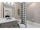 The stylish bathroom is equipped with modern fixtures and a shower-tub combination at 15319 Soaring Bluff Dr, Montverde, FL 34756
