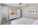 Bright bedroom with neutral palette, ample closet space and an adjoining bathroom at 15319 Soaring Bluff Dr, Montverde, FL 34756