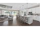 Modern kitchen with an island, white cabinetry, and stainless steel appliances at 15319 Soaring Bluff Dr, Montverde, FL 34756