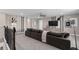 Cozy living room features plush seating, modern ceiling fan, and stylish decor at 15319 Soaring Bluff Dr, Montverde, FL 34756