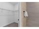 Functional walk-in closet and adjacent shower with stylish tile at 15319 Soaring Bluff Dr, Montverde, FL 34756