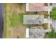 Aerial view of a home, showcasing its roof, lawn, and proximity to the lake, highlighting the neighborhood layout at 1556 Sherbourne St, Winter Garden, FL 34787