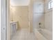 Bathroom with white vanity, tub-shower combination, and white tile flooring at 1556 Sherbourne St, Winter Garden, FL 34787