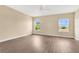 Bedroom with new laminate flooring and two large windows at 1556 Sherbourne St, Winter Garden, FL 34787