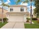 Charming two-story home with well-maintained lawn and two-car garage at 1556 Sherbourne St, Winter Garden, FL 34787