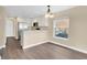 Kitchen includes stainless steel refrigerator and white cabinets at 1556 Sherbourne St, Winter Garden, FL 34787