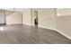 Spacious living room with new floors, and multiple entryways at 1556 Sherbourne St, Winter Garden, FL 34787