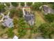 Aerial shot of property showcasing the home, pool, and surrounding landscaped yard and neighborhood at 1709 Iverness Ct, Longwood, FL 32779