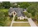 Expansive aerial view of a luxurious residence featuring mature landscaping, and a well-maintained driveway at 1709 Iverness Ct, Longwood, FL 32779