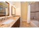 Bathroom boasting double sinks, granite countertops, and a bathtub and shower combo at 1709 Iverness Ct, Longwood, FL 32779
