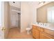 Bright bathroom with stylish vanity, tile flooring, toilet, and glass-enclosed shower at 1709 Iverness Ct, Longwood, FL 32779