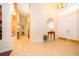 Bright foyer with tile flooring, high ceilings, elegant lighting, and a decorative window at 1709 Iverness Ct, Longwood, FL 32779