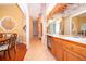Bright hallway with tile flooring, a built-in bar area, and views into the dining and living spaces at 1709 Iverness Ct, Longwood, FL 32779