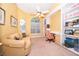 Comfortable home office area featuring built-in bookshelves and a curved sofa at 1709 Iverness Ct, Longwood, FL 32779