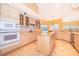 Open kitchen featuring tile floors, a center island, modern appliances, and ample cabinet space at 1709 Iverness Ct, Longwood, FL 32779