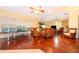 Spacious living room with hardwood floors, large windows, and comfortable seating at 1709 Iverness Ct, Longwood, FL 32779