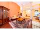 Bright living room with hardwood floors, tall ceilings, a large window, and comfortable seating at 1709 Iverness Ct, Longwood, FL 32779