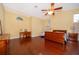 Spacious bedroom with hardwood floors, a ceiling fan, and plenty of natural light at 1709 Iverness Ct, Longwood, FL 32779