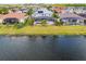 Aerial view of the back of the home featuring a screened in pool and lake view at 1712 Boat Launch Rd, Kissimmee, FL 34746