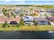Aerial view of home and backyard with pool, lush landscaping, and lakefront location at 1712 Boat Launch Rd, Kissimmee, FL 34746