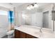 Bright bathroom featuring a tiled tub and shower combination and vanity with sink at 1712 Boat Launch Rd, Kissimmee, FL 34746