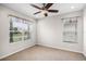 Empty bedroom with large window and neutral carpet at 1712 Boat Launch Rd, Kissimmee, FL 34746