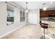 Bright dining area featuring tile flooring, stylish pendant lights, and a view of the outdoors at 1712 Boat Launch Rd, Kissimmee, FL 34746