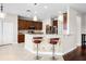 Kitchen with a breakfast bar featuring stylish pendant lighting and tiled floors at 1712 Boat Launch Rd, Kissimmee, FL 34746