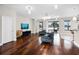 Bright living room with hardwood floors, stylish furnishings, and a view of the backyard at 1712 Boat Launch Rd, Kissimmee, FL 34746