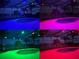 Screened-in pool featuring multi-colored LED lighting for relaxing evenings by the water at 1712 Boat Launch Rd, Kissimmee, FL 34746