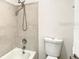 Bathroom featuring a bathtub and tile walls at 1826 Warringwood Dr # B-1, Orlando, FL 32839
