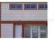 Charming home exterior with white siding, red trim, and well-placed windows at 1826 Warringwood Dr # B-1, Orlando, FL 32839