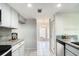 Open kitchen with stainless steel appliances, and granite countertops at 1826 Warringwood Dr # B-1, Orlando, FL 32839