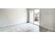 Bright room featuring tile floors and sliding glass doors at 1826 Warringwood Dr # B-1, Orlando, FL 32839