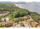 Aerial view of the community showcasing lush landscaping, nearby waterways, and ample parking at 190 Hickory Woods Ct # 12B, Deltona, FL 32725