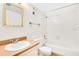 Full bathroom featuring a shower-tub combo, neutral walls, large mirror, and tan vanity at 190 Hickory Woods Ct # 12B, Deltona, FL 32725