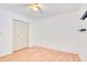 Bright bedroom featuring neutral walls, ceiling fan, and laminate floors, paired with a sizable closet at 190 Hickory Woods Ct # 12B, Deltona, FL 32725