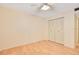 Bright bedroom featuring neutral walls, ceiling fan, and laminate floors, paired with a sizable closet at 190 Hickory Woods Ct # 12B, Deltona, FL 32725