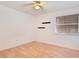 Bright bedroom featuring neutral walls, laminate floors, and a sunlit window with blinds at 190 Hickory Woods Ct # 12B, Deltona, FL 32725
