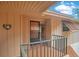 Inviting entrance with welcome sign and covered porch and unit number, creating a cozy ambiance at 190 Hickory Woods Ct # 12B, Deltona, FL 32725