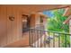 Inviting entrance with welcome sign and covered porch and unit number, creating a cozy ambiance at 190 Hickory Woods Ct # 12B, Deltona, FL 32725