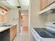 Functional kitchen with black appliances and white tile floors, offering a practical cooking space at 190 Hickory Woods Ct # 12B, Deltona, FL 32725