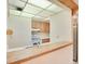Bright kitchen with wood breakfast bar, white appliances, and functional layout for efficient cooking at 190 Hickory Woods Ct # 12B, Deltona, FL 32725