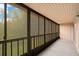 Enclosed porch offering serene views of the surrounding greenery at 190 Hickory Woods Ct # 12B, Deltona, FL 32725