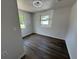 Comfortable bedroom with stylish flooring, neutral decor, and plenty of natural light, creating a serene and inviting space at 1921 Nw 12Th St, Ocala, FL 34475